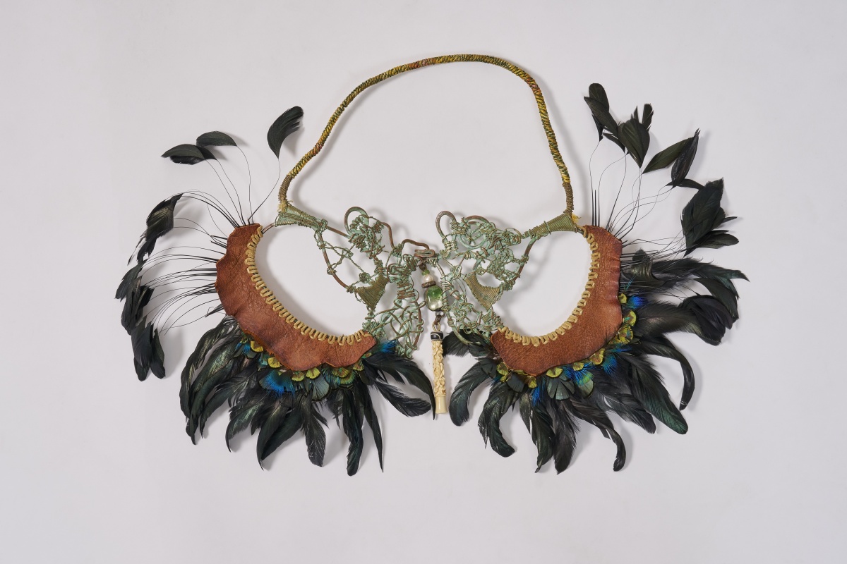 An Alex and Lee 'Peace and Love' copper, leather and feather necklace, 1970s