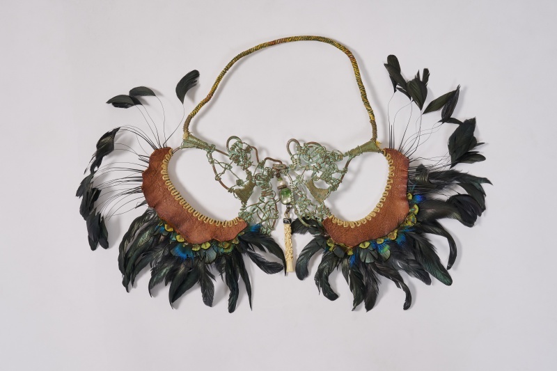 An Alex and Lee 'Peace and Love' copper, leather and feather necklace, 1970s