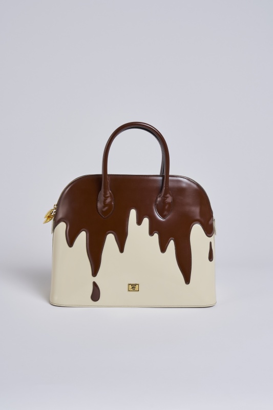 A Moschino 'Fudge the Fashionistas, Let Them Eat Cake' bag, circa 1996