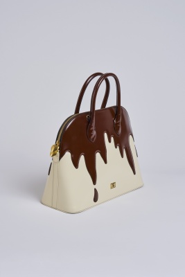 A Moschino 'Fudge the Fashionistas, Let Them Eat Cake' bag, circa 1996 - 2
