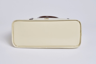 A Moschino 'Fudge the Fashionistas, Let Them Eat Cake' bag, circa 1996 - 7