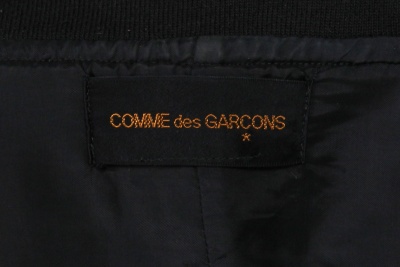 A Comme des Gar&ccedil;ons black ensemble, 'Modern Sweetness' collection, Autumn-Winter 1990-91 - 12