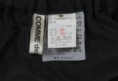 A Comme des Gar&ccedil;ons black ensemble, 'Modern Sweetness' collection, Autumn-Winter 1990-91 - 13