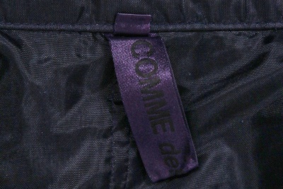 A Comme des Gar&ccedil;ons garment-dyed purple gabardine ensemble, 'Coercion' collection, Spring-Summer 2000 - 12