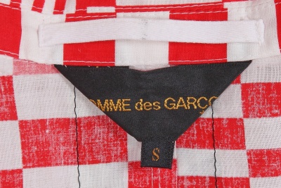 A Comme des Gar&ccedil;ons red and white printed suit, 'Optical Shock (Volume)' collection, Spring-Summer 2001 - 11