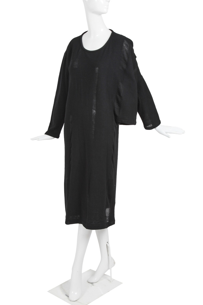 An important Comme des Gar&ccedil;ons distressed black wool dress, probably 'Holes' collection, Autumn-Winter 1982-83