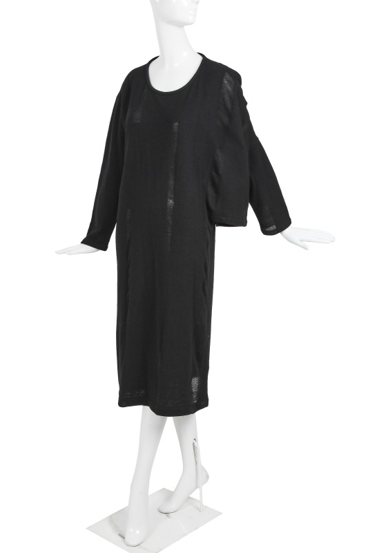 An important Comme des Gar&ccedil;ons distressed black wool dress, probably 'Holes' collection, Autumn-Winter 1982-83