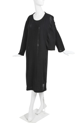 An important Comme des Gar&ccedil;ons distressed black wool dress, probably 'Holes' collection, Autumn-Winter 1982-83